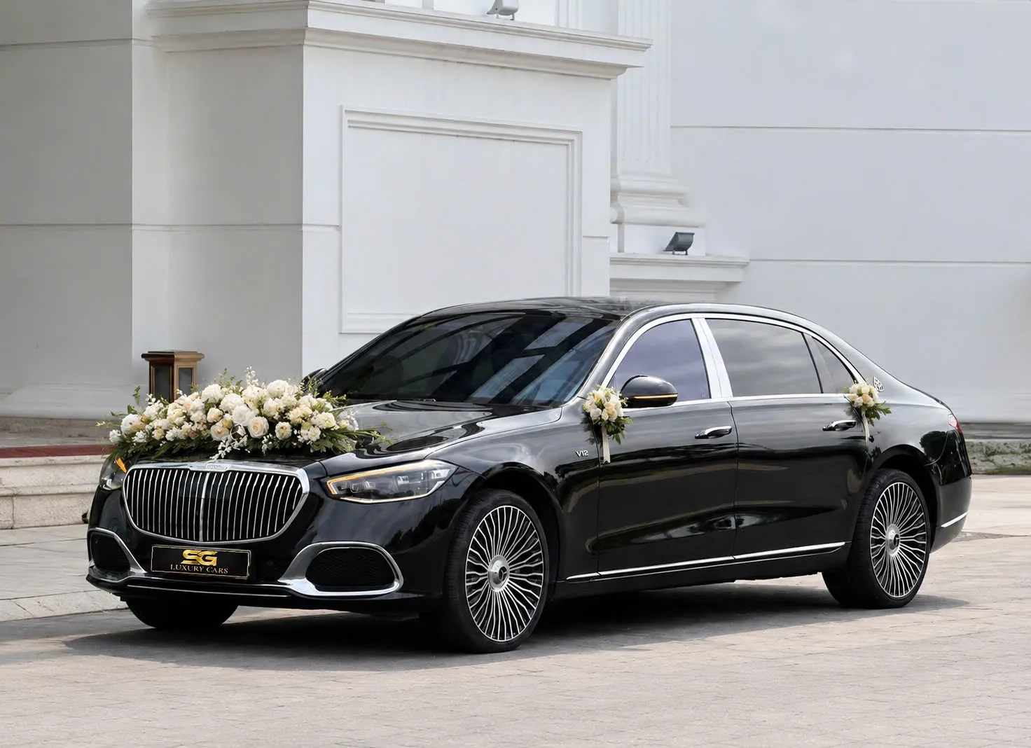 Luxury wedding car rental Vietnam - Maybach S580 with wedding flowers